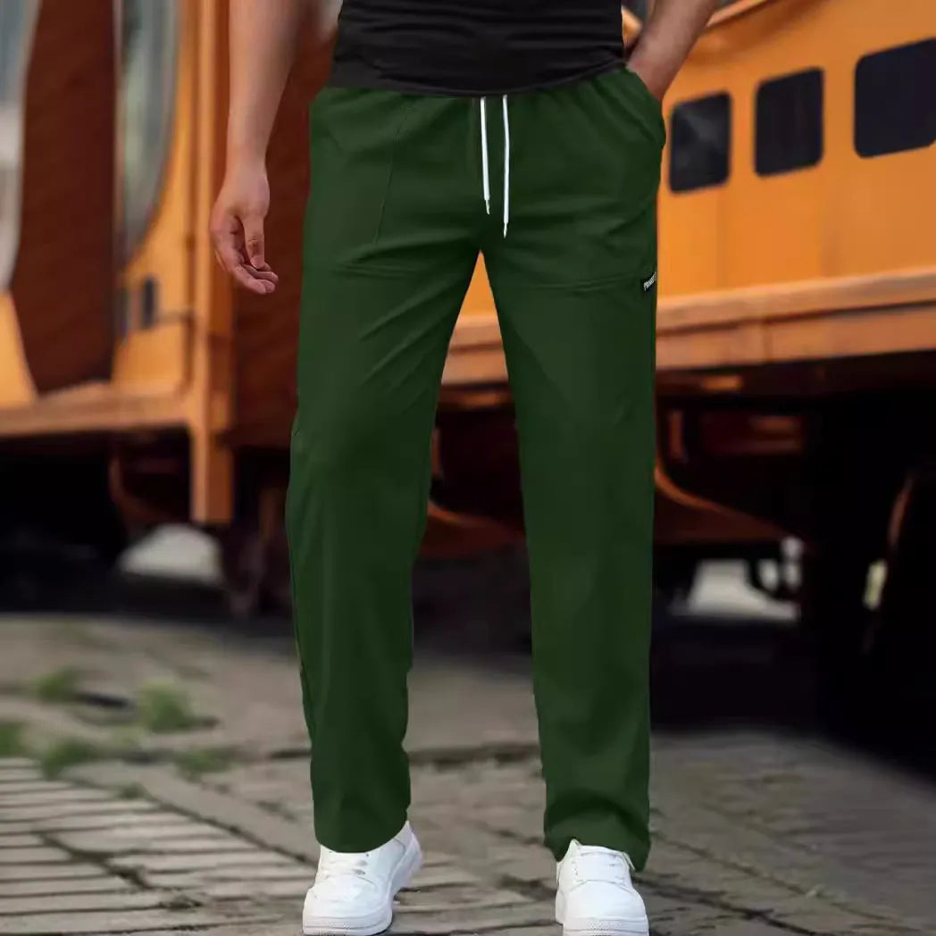 Men's polyester trousers in light grey colour shown flat