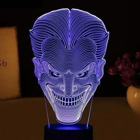 USB-powered 3D acrylic LED table lamp with remote control on a desk, displaying a gradient colour mode.