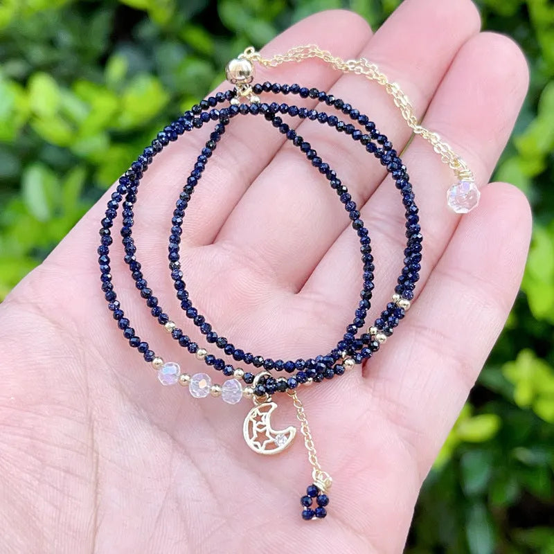 Blue and gold multi-layer women's bracelet with cut sand stone on a three-ring design.