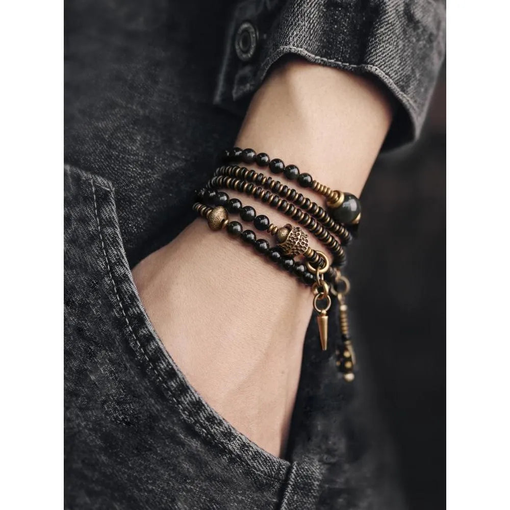 Geometric black beaded bracelet with multi-layered construction and colourful detailing