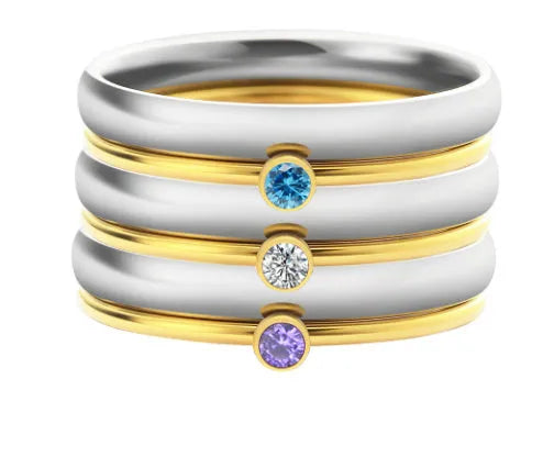 December birthstone engraved titanium steel ring with geometric design on a grey background.