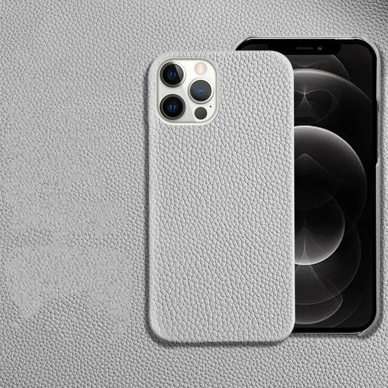 Genuine leather half-frame protective case for iPhone on a table in beige colour.