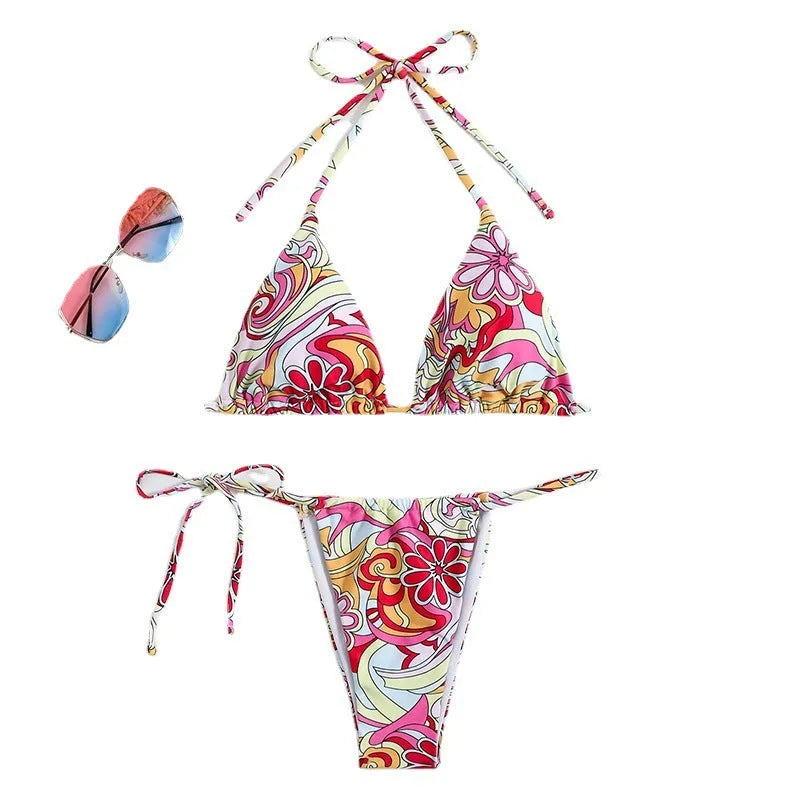 Women's multicolour printed triangle bikini top with hanging neck and matching briefs.
