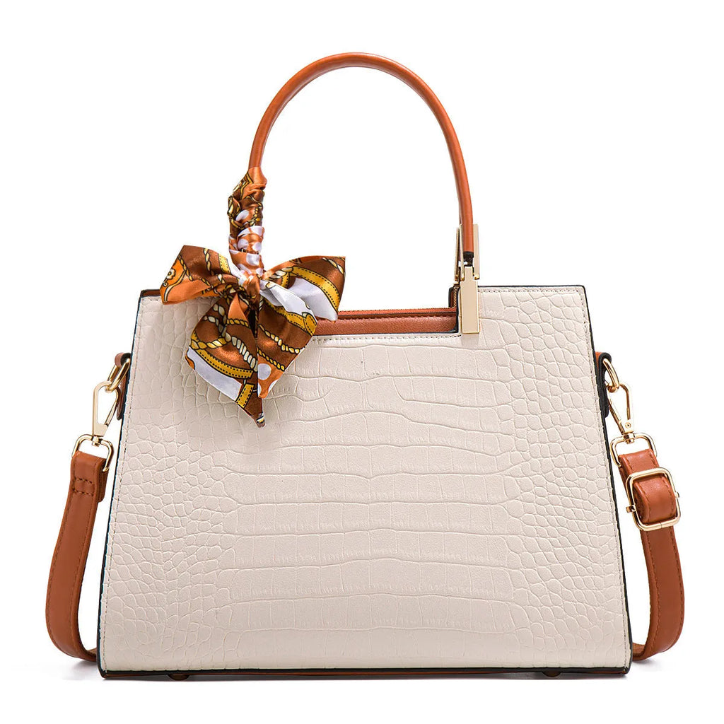 Milky white women's large shoulder handbag with internal compartments and slit pocket.