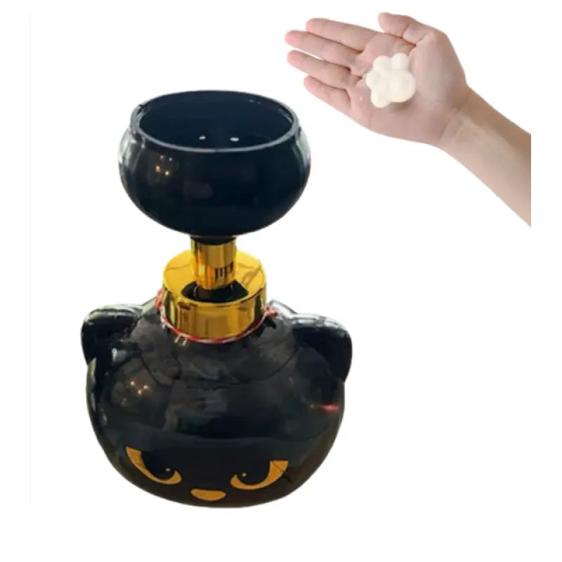 Black cartoon cat shaped manual foam soap dispenser on countertop