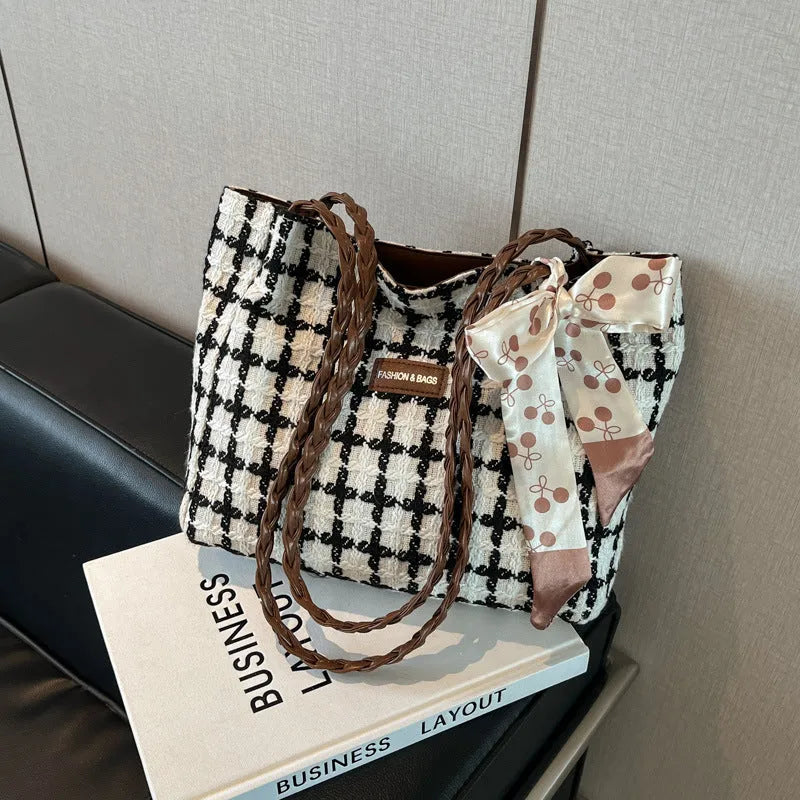 Black woolen shoulder bag with horizontal square shape and internal organisation compartments