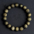 Obsidian ball bracelet with natural crater texture in silver stone meteorite colour with grinding finish