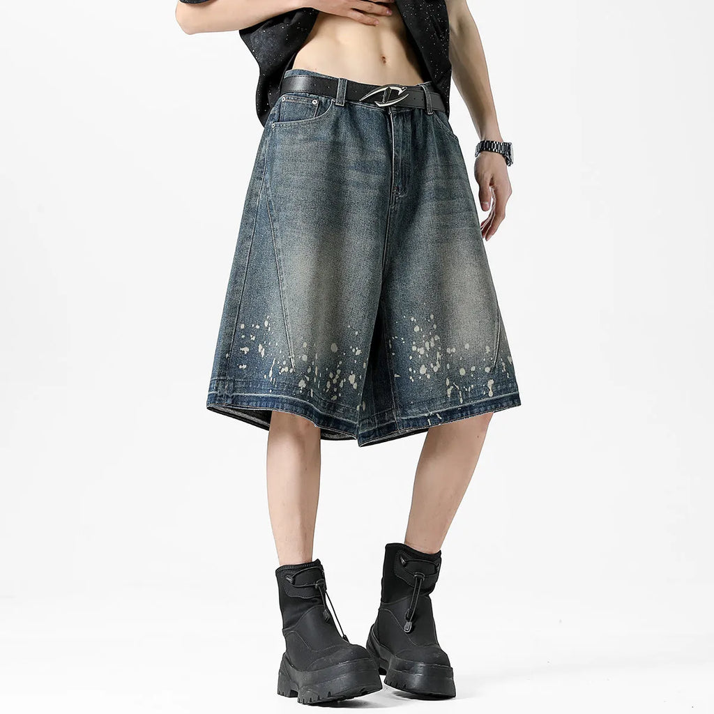 Men's retro washed blue denim shorts with splash ink detailing and ripped accents