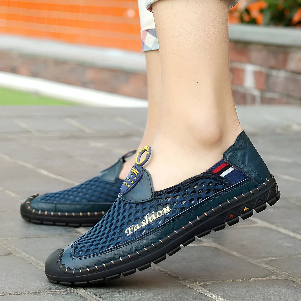 Men's brown mesh casual shoes with round toe and rubber sole on a plain background