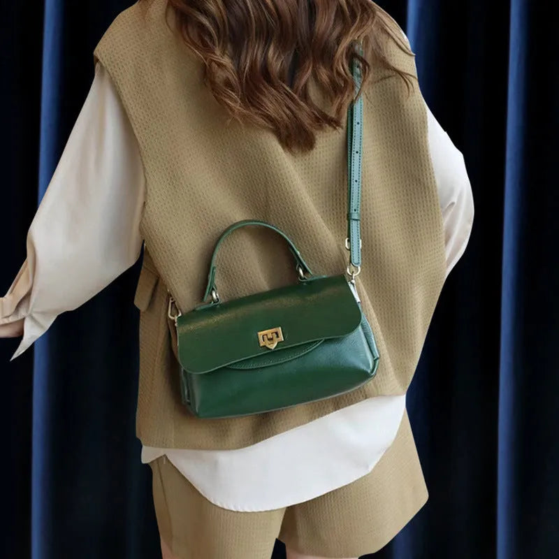 A dark brown women's leather saddle handbag with visible stitching and an open front pocket.