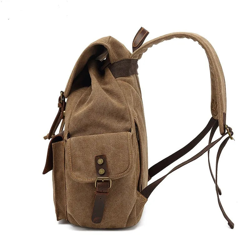 Retro polyester cotton canvas backpack in military green with antique bronze hardware, showing front and side view.