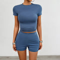 Women's solid colour viscose two-piece sports set with short-sleeve T-shirt and elastic shorts.