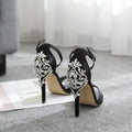 Black suede high heel women's shoes with rhinestone decoration and a fish mouth toe.