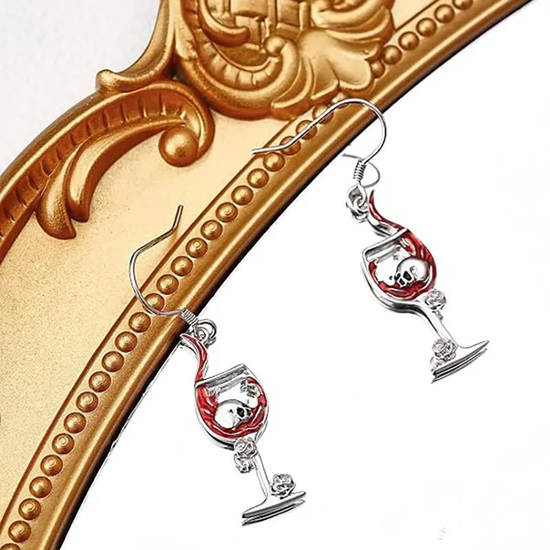A pair of zinc alloy Halloween earrings with a skull and wine glass design.