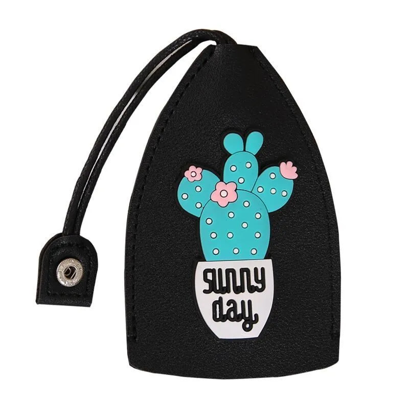 Cartoon-design PU leather pull-out key case for car keys, shown with pull tab extended.