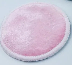 Set of red and blue velvet makeup remover pads next to an organic cotton mesh bag.