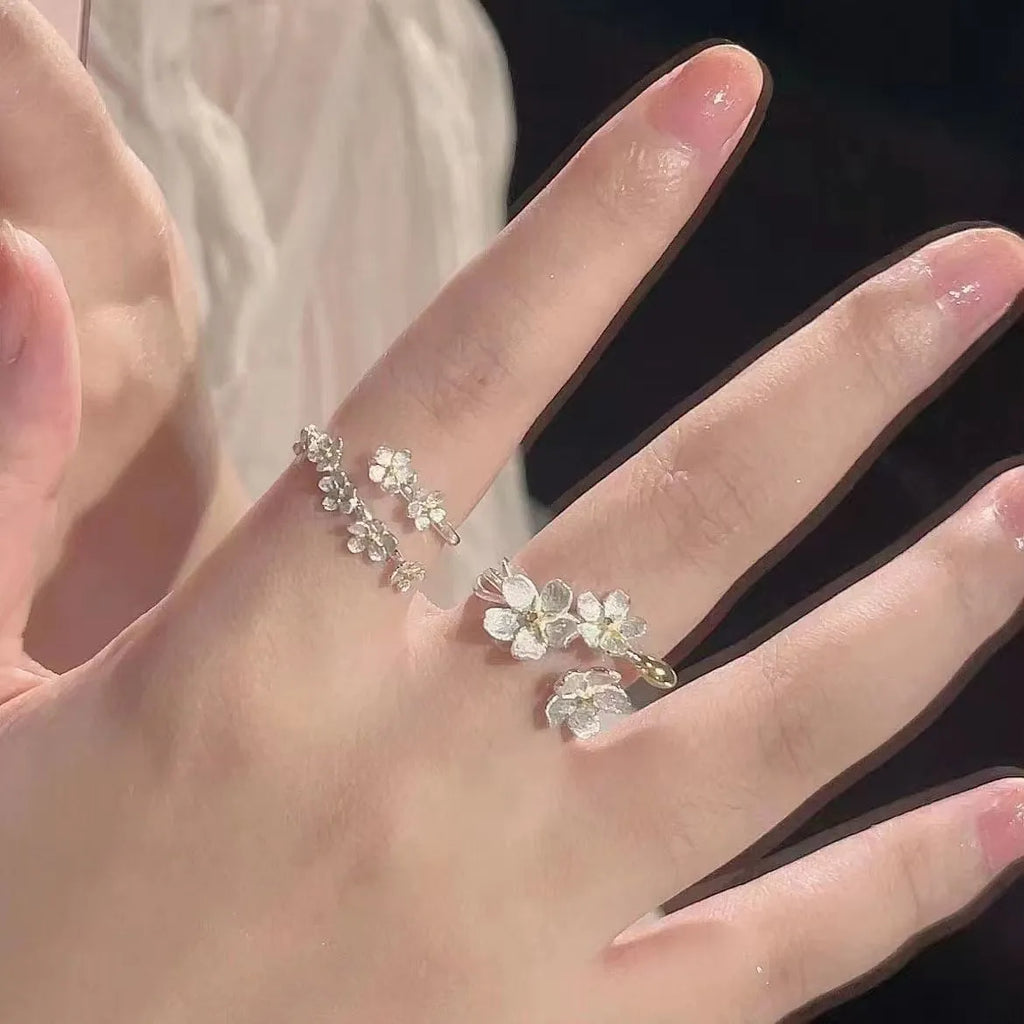 Adjustable open mouth zinc alloy ring with three-dimensional jasmine flower and camellia design