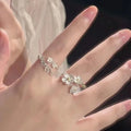Adjustable open mouth zinc alloy ring with three-dimensional jasmine flower and camellia design