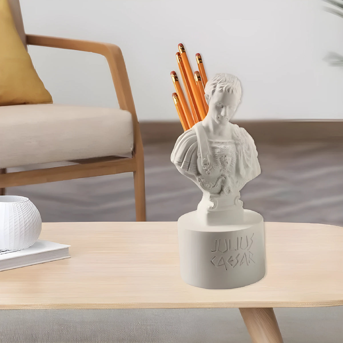 White synthetic resin pen holder with American creative character modelling design on a desk.