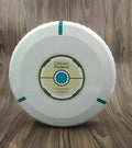 Black or white automatic sweeping robot on a wooden floor, showing compact square design.