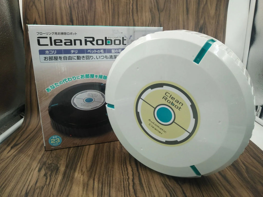 Black or white automatic sweeping robot on a wooden floor, showing compact square design.