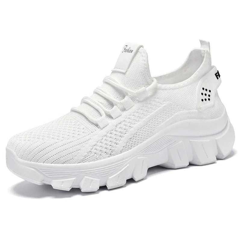 Women's white Flyknit sneakers with thick PVC sole and lace-up front
