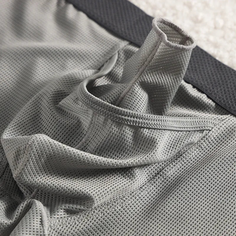 Men's ice silk boxer shorts in black colour showing low-waist design and mesh fabric texture