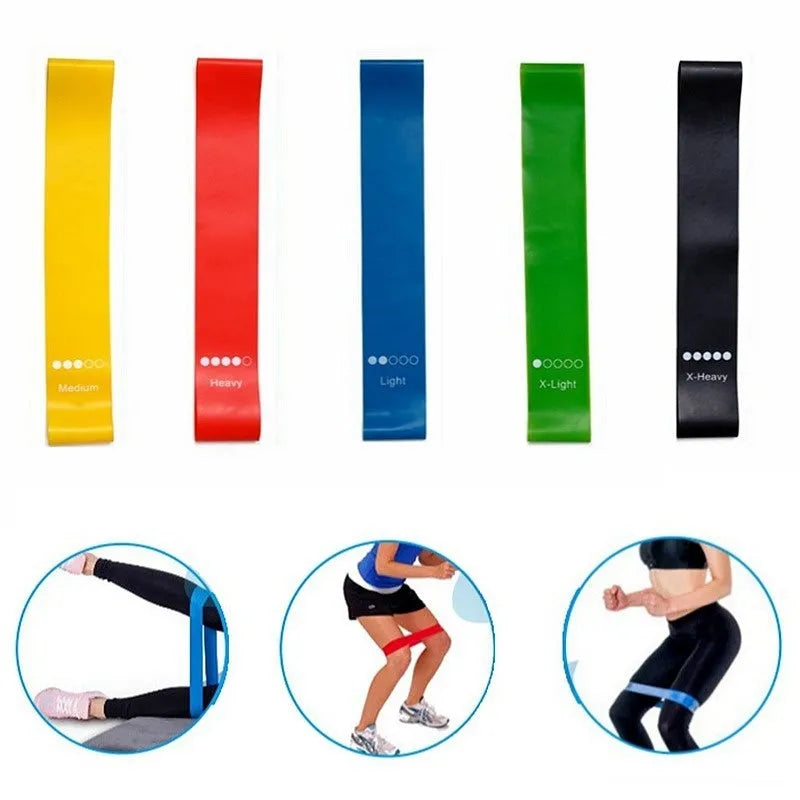Five yoga tension straps in different colours with force markings for progressive resistance training