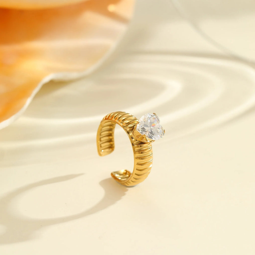 Open mouth stainless steel ring with gold plating and zircon geometric detailing