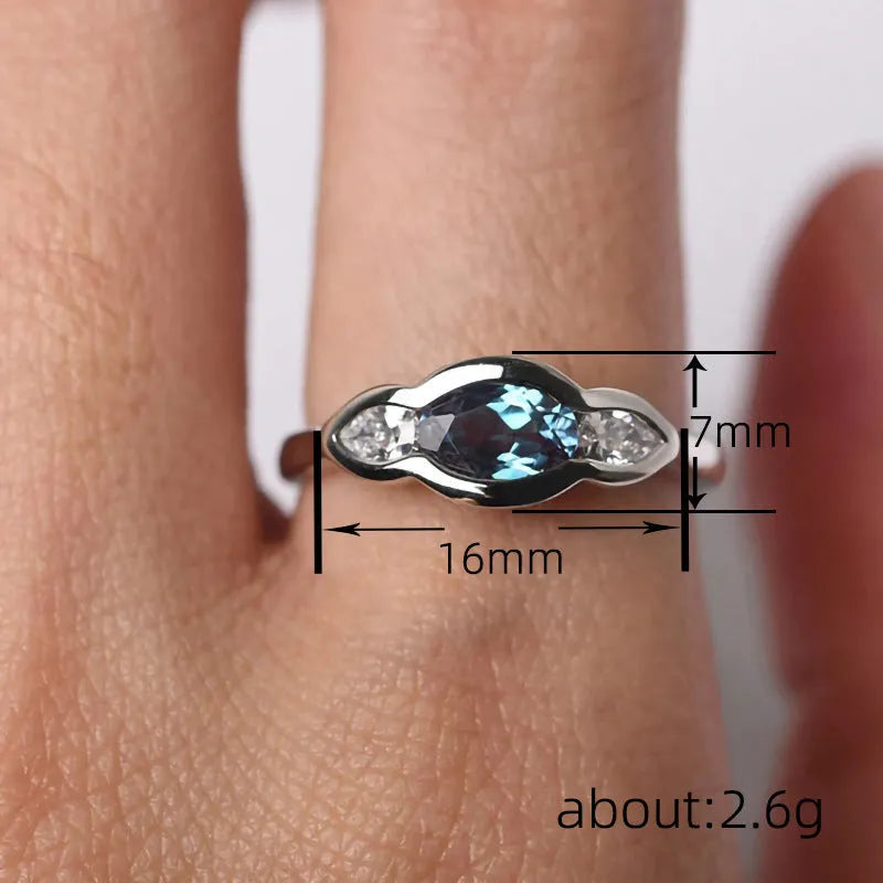 Geometric ellipse women's ring with zircon centre stone in white gold colour