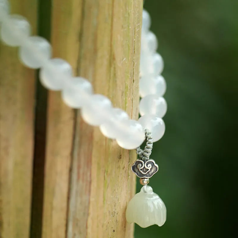 Women's S925 silver bracelet with white agate and Hetian jade stones in geometric lotus pattern
