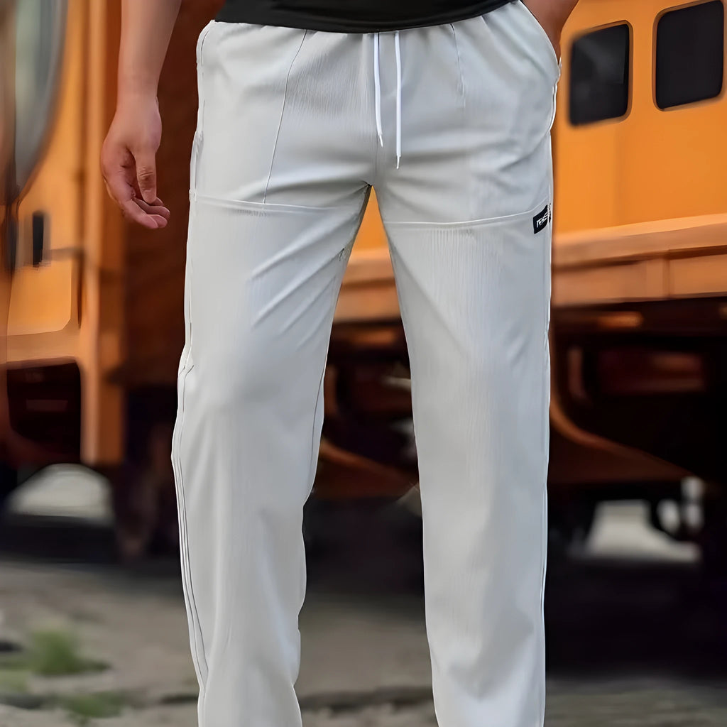 Men's polyester trousers in light grey colour shown flat