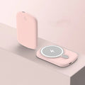 Magsafe magnetic power bank for iPhone wireless charging in black, pink, white, or purple.