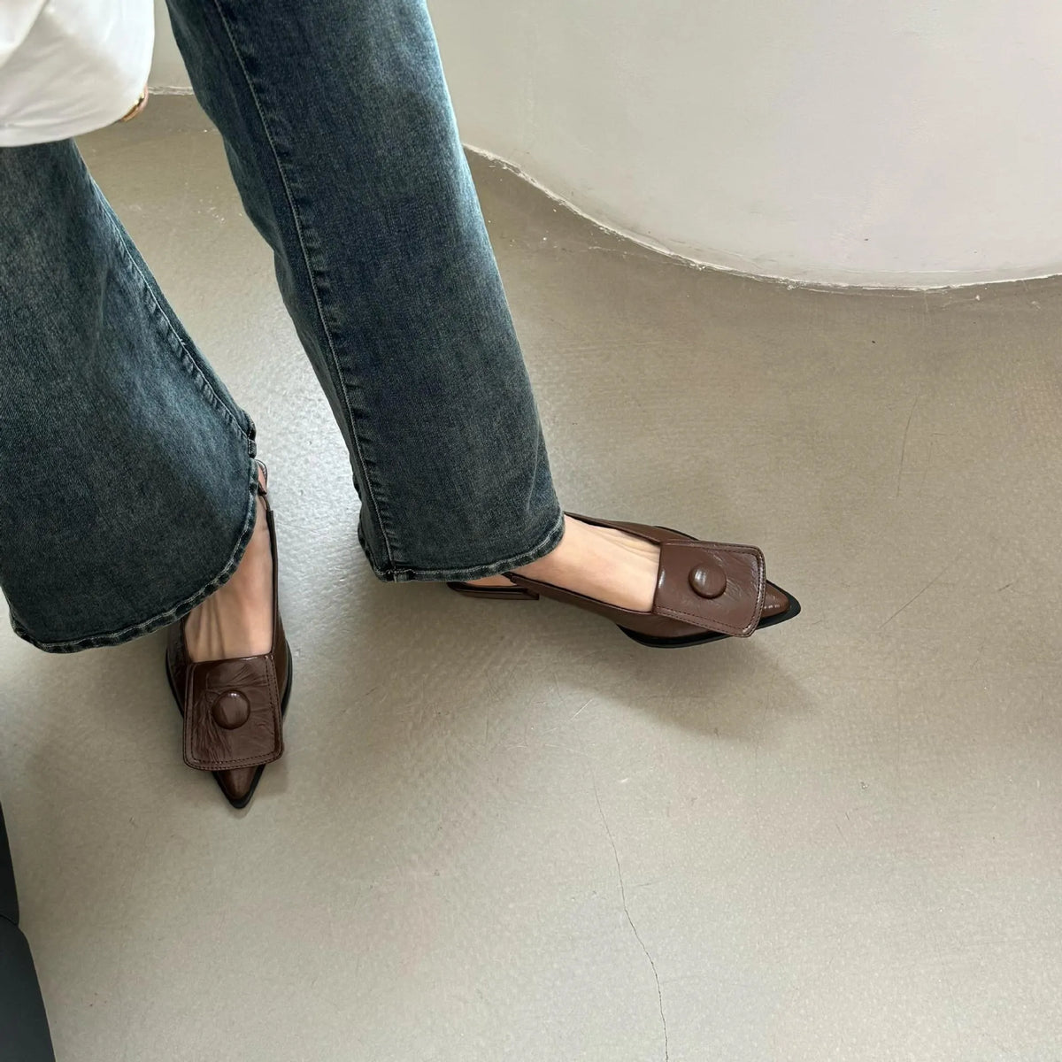 Women's low heel pointed toe sandals in apricot colour with a back strap and closed toe
