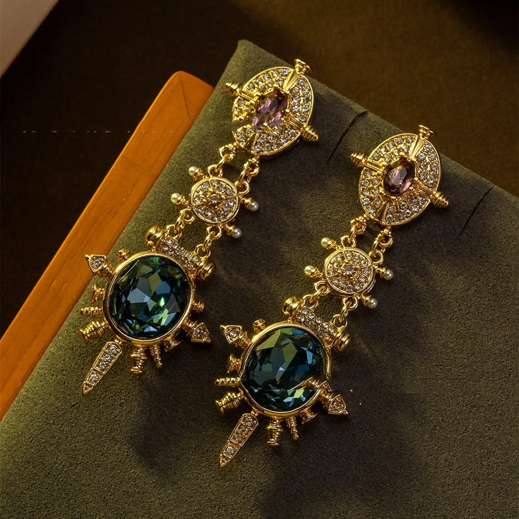 A pair of gold retro-style stud earrings with a geometry and round shape.
