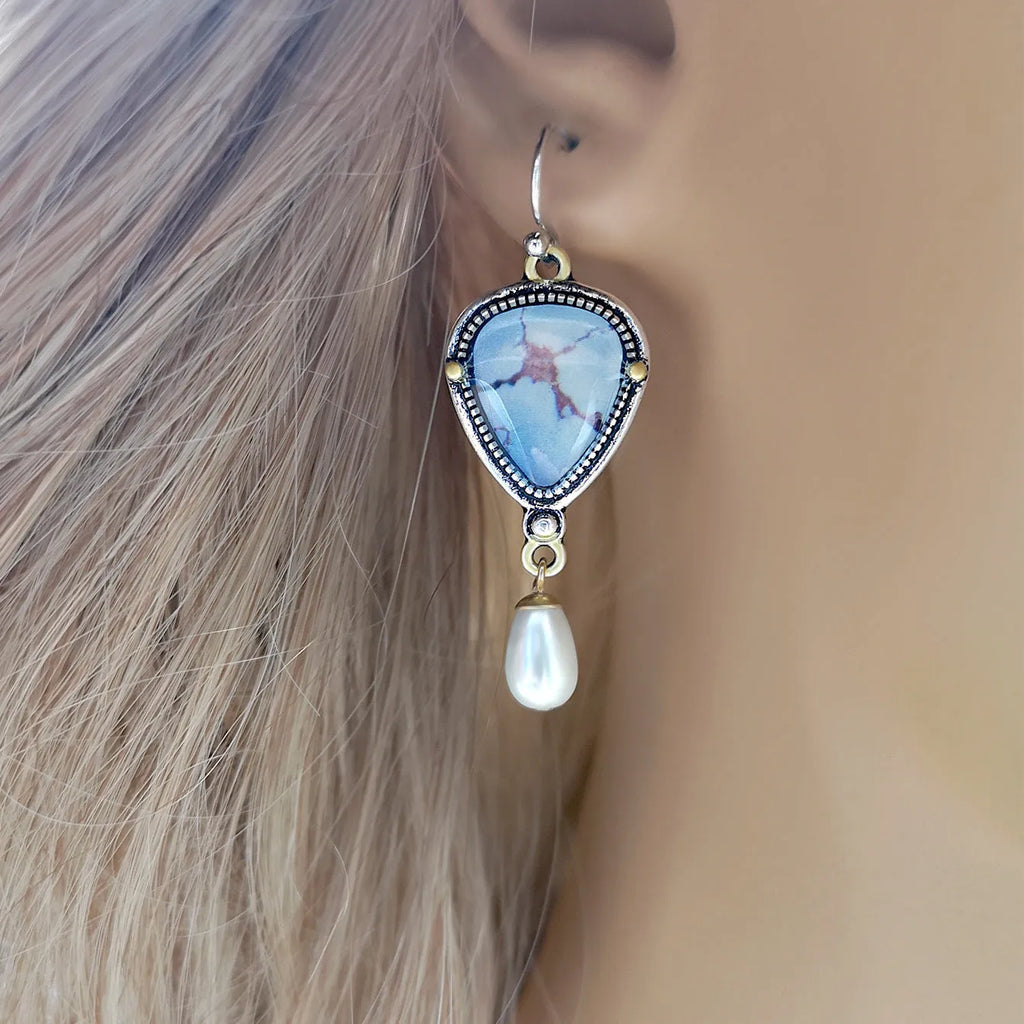 Retro blue bohemian drop earrings with lavender turquoise and pearl elements on geometric metal setting