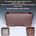 Square purple clay succulent bonsai pot in classical style on wooden table