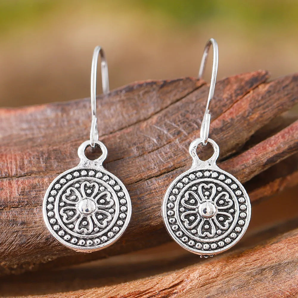 Round bohemian retro earrings with distressed ethnic print in electroplated zinc alloy