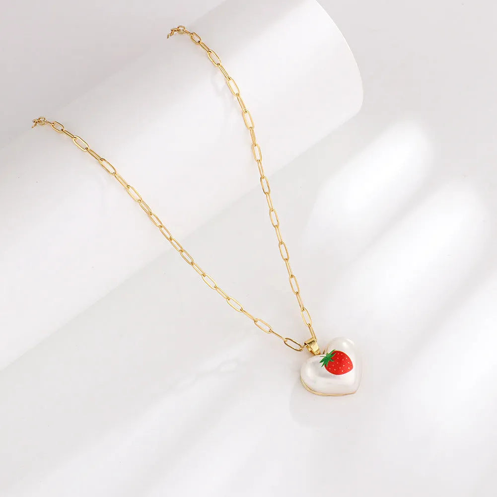 Geometric heart necklace with fruit pendant on adjustable chain in apple cherry pear pineapple strawberry designs