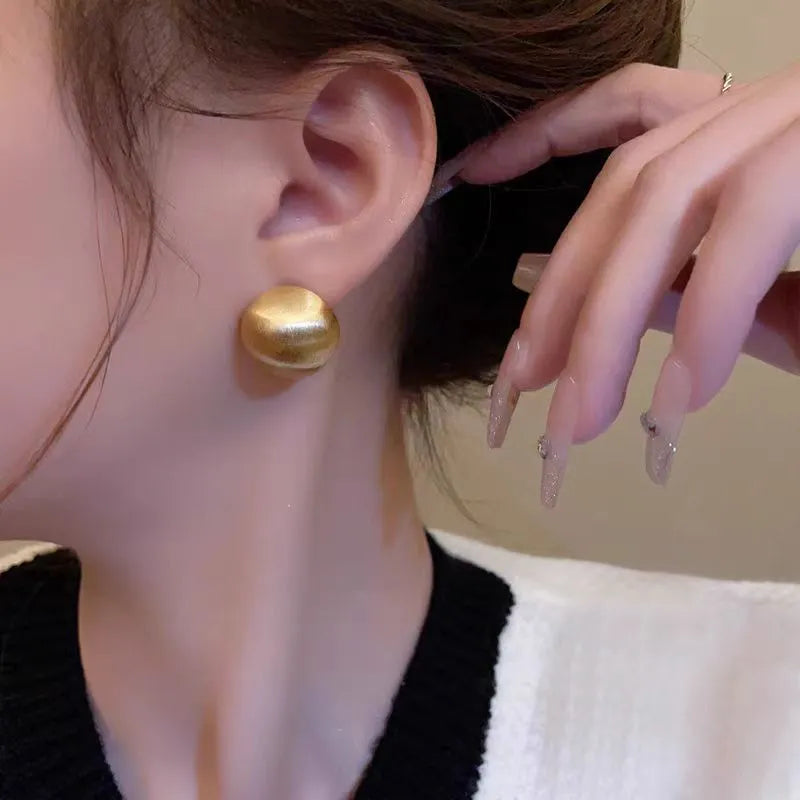 Matte brushed bean-shaped stud earrings in Gold and White for women, compact versatile metal earrings