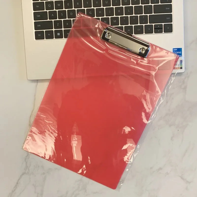Clear plastic A4 plate holder with metal clip holding documents, available in multiple colours including blue, green, red and white.