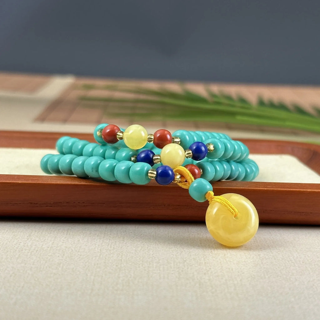 Turquoise stone mesh flower lucky pendant necklace on a ball bead chain, adjustable length.