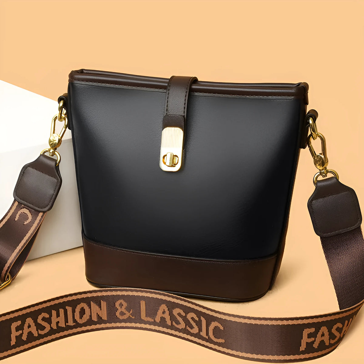 Korean style black bucket messenger bag with double shoulder strap showing zip compartments and urban design details