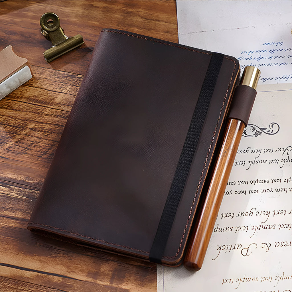 Handmade cowhide notebook with wood-free paper in six colour options showing 9x14cm dimensions