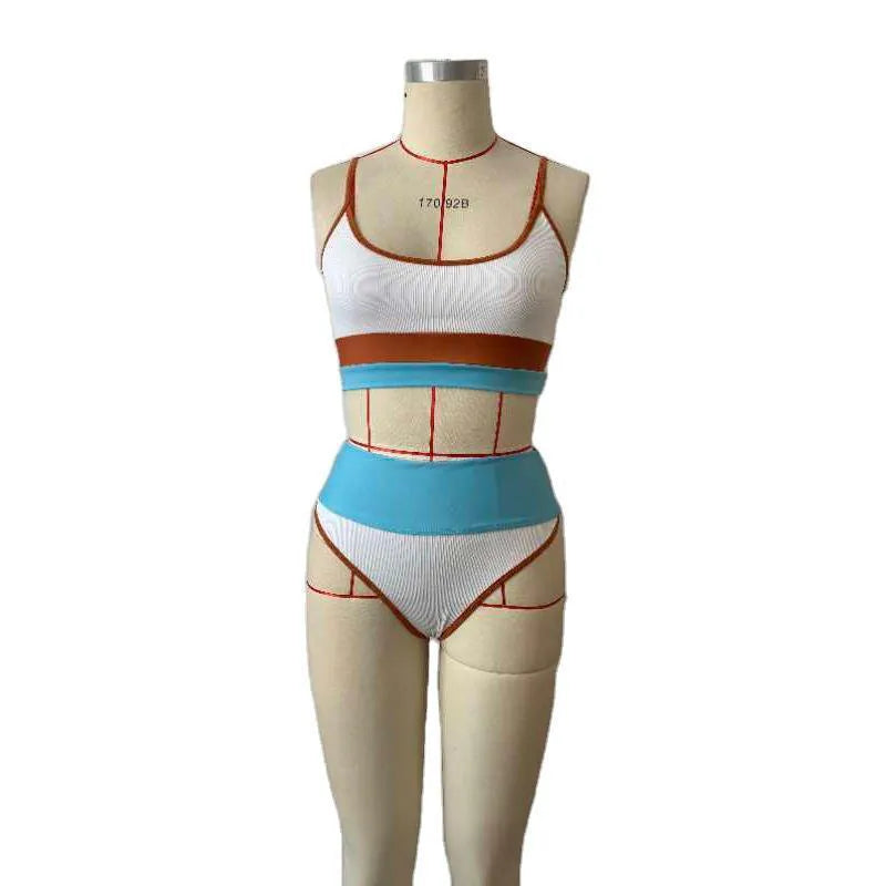 Women's solid colour quick-dry swimwear set showing bikini top and matching shorts