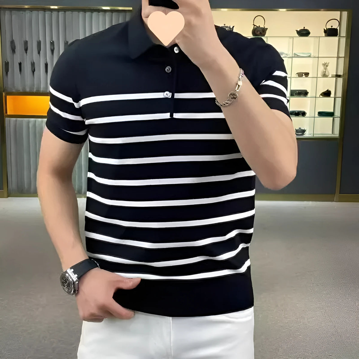 Black and white striped lapel knitted t-shirt on hanger showing pullover style