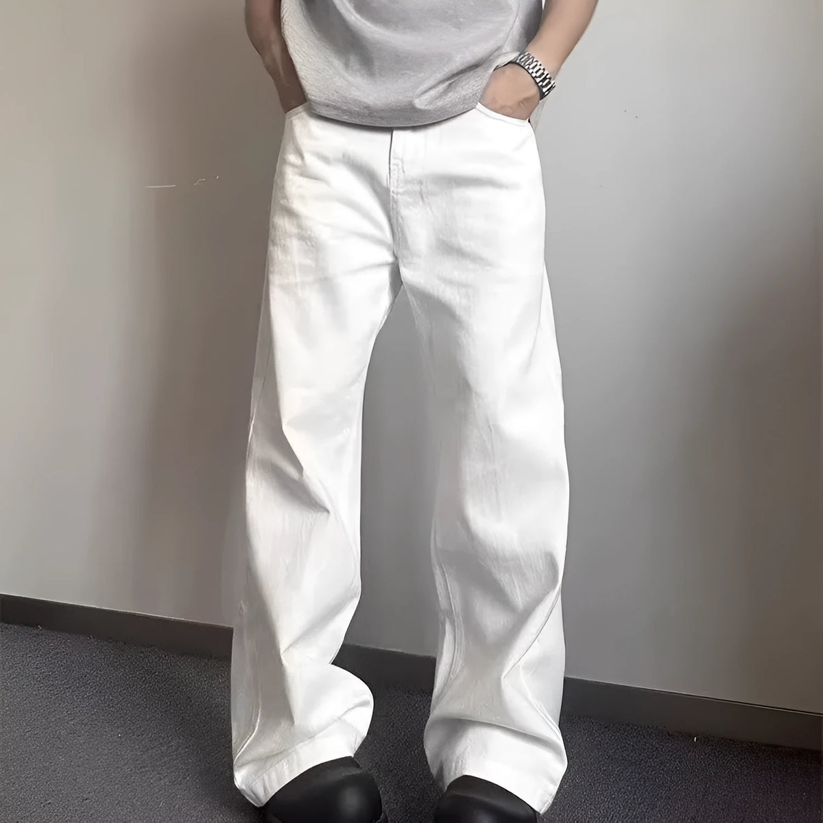 Men's white straight-leg cotton jeans with a mid-rise waist and zipper fly