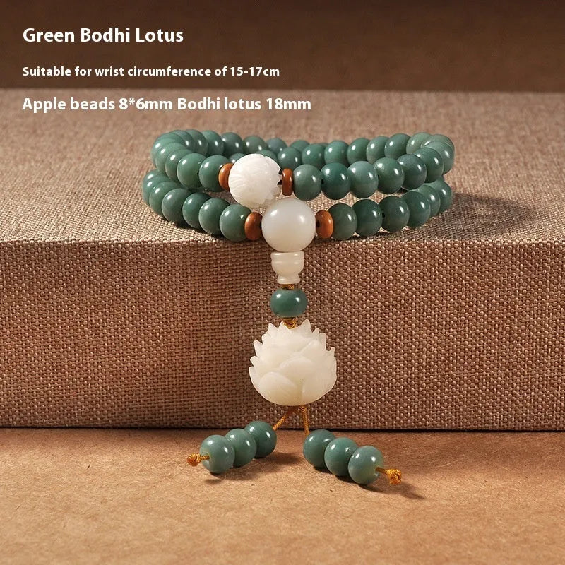 White jade and green sandalwood beaded bracelet with a double ring lotus safety buckle clasp.
