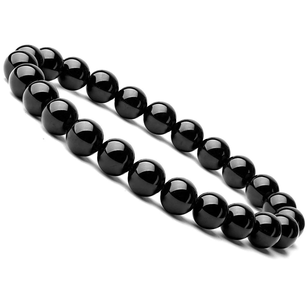 Geometric black onyx bracelet with 8mm beads on a black elastic cord, laid flat.