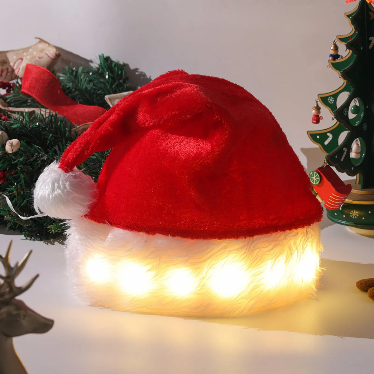 Red and white plush LED Santa hat with pom-pom and multi-colour twinkling lights on model.
